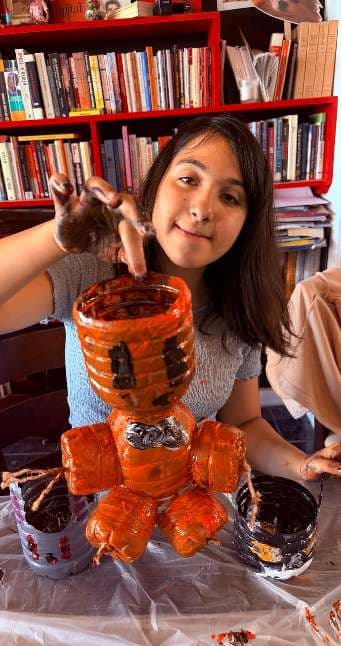Painting and detailing a recycled sculpture